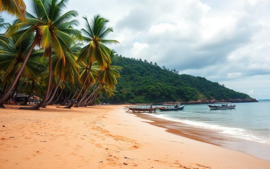 Maha Induruwa quiet local coastal beach Sri Lanka empty golden sand with palm trees, small fishing boats and undeveloped local west coast scenery